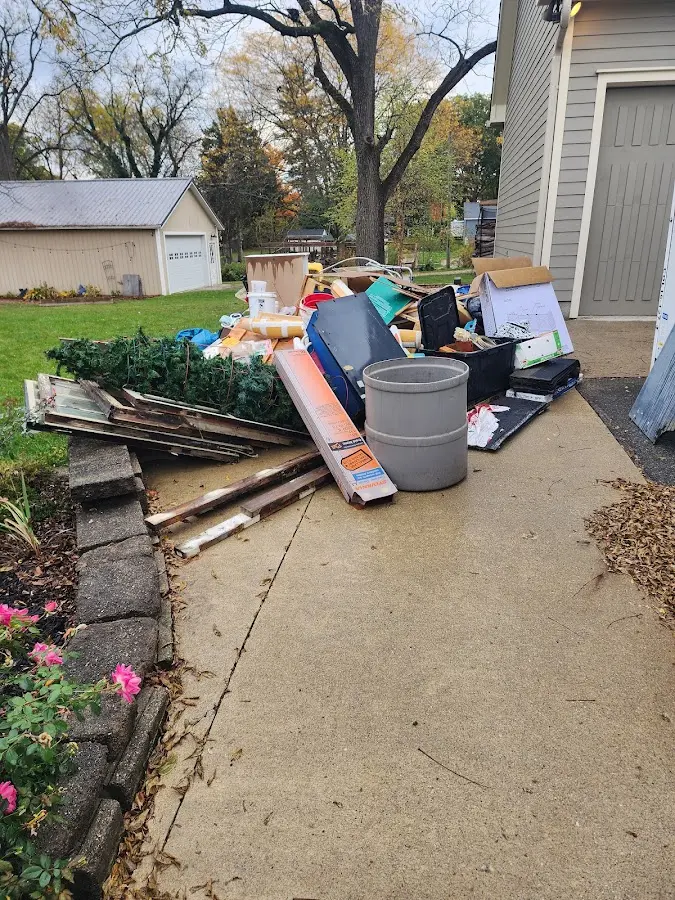 Dumpster being loaded with debris for Estate Cleanout Dumpster Rental in Sebastopol
